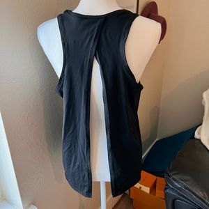 Womens Sports top, open flow back. Size Medium, brand new. Super soft